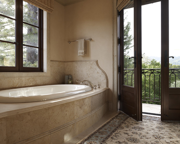 Источник вдохновения для домашнего уюта: главная ванная комната в средиземноморском стиле с накладной ванной, бежевой плиткой, каменной плиткой, бежевыми стенами и полом из известняка