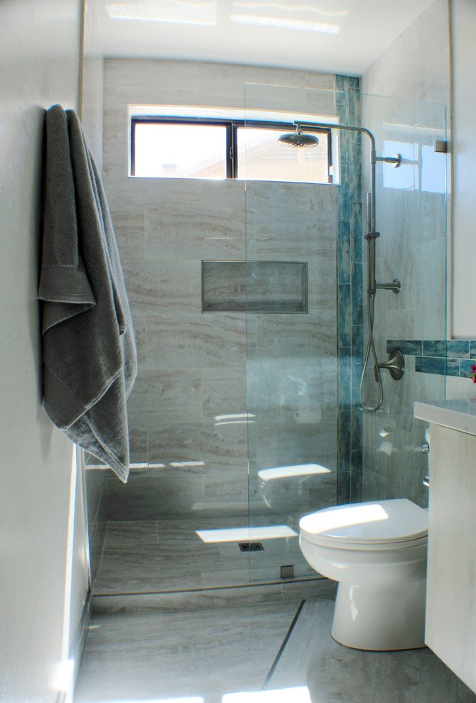 Inspiration for a small contemporary bathroom in Phoenix with flat-panel cabinets, light wood cabinets, a two-piece toilet, grey tiles, porcelain tiles, white walls, porcelain flooring, a submerged sink, engineered stone worktops, grey floors, an open shower and grey worktops.