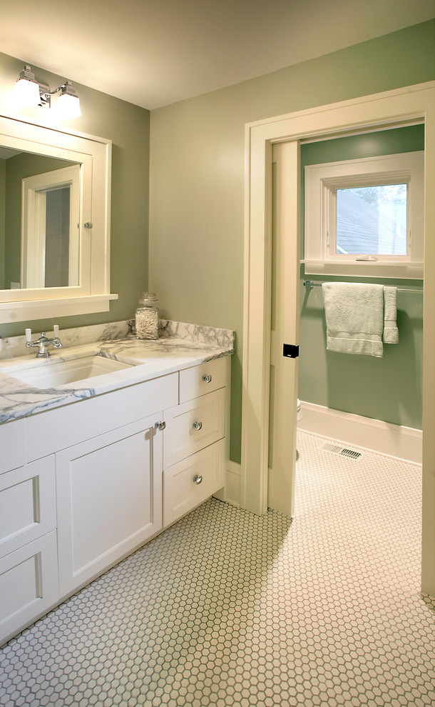 This is an example of a classic bathroom in Minneapolis with an enclosed toilet.