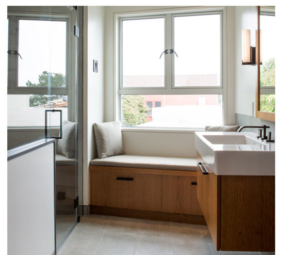 Example of a small minimalist gray tile and porcelain tile porcelain tile bathroom design in San Francisco with an integrated sink, flat-panel cabinets, medium tone wood cabinets and gray walls