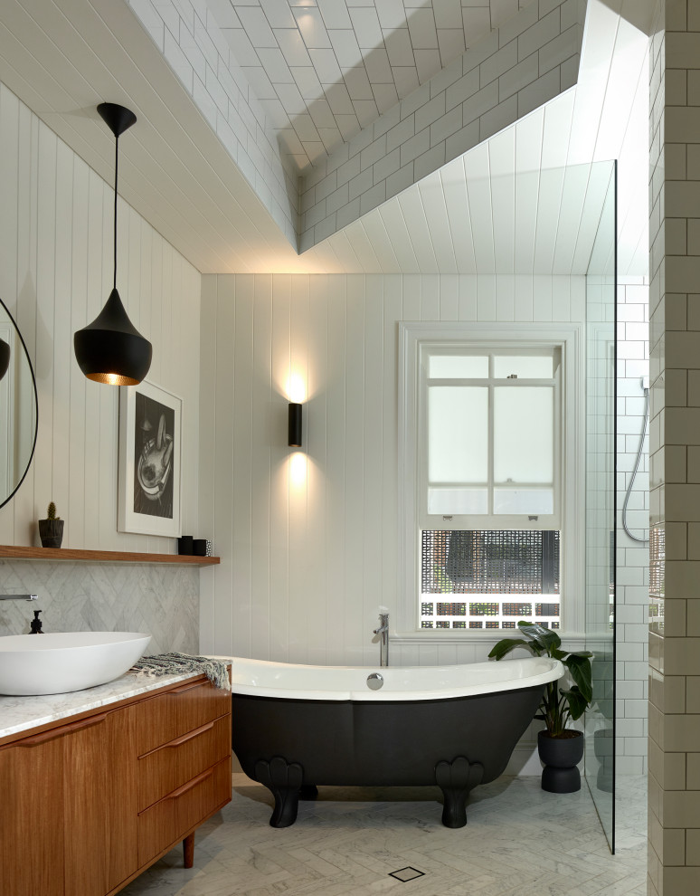 Contemporary bathroom in Brisbane with flat-panel cabinets, medium wood cabinets, a claw-foot bath, an alcove shower, white tiles, metro tiles, white walls, a vessel sink, white floors, an open shower, white worktops, a single sink, a freestanding vanity unit, a drop ceiling and tongue and groove walls.