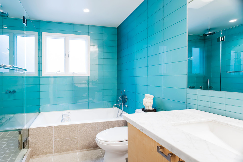 This is an example of a modern bathroom in San Francisco with glass tiles and blue tiles.