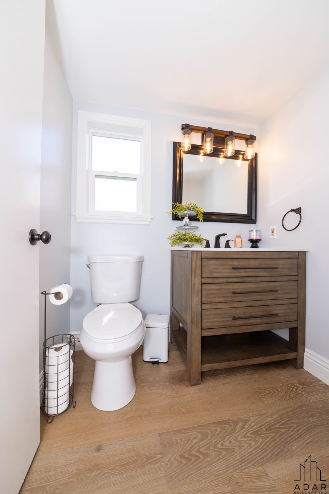Стильный дизайн: ванная комната среднего размера в стиле модернизм с коричневыми фасадами, белой столешницей и тумбой под одну раковину - последний тренд