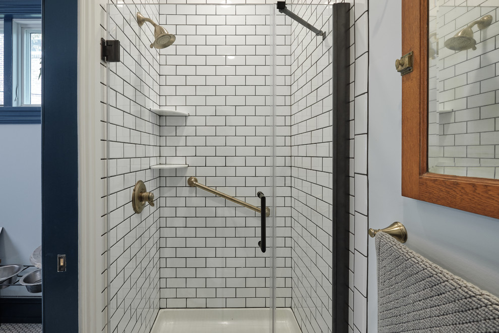 Small bohemian shower room bathroom in Philadelphia with open cabinets, grey cabinets, an alcove shower, a two-piece toilet, white tiles, metro tiles, grey walls, mosaic tile flooring, a pedestal sink, white floors and a hinged door.