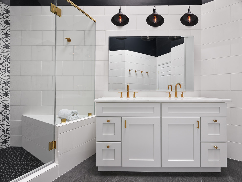 Large classic shower room bathroom in DC Metro with shaker cabinets, white cabinets, white tiles, black and white tiles, a submerged sink, a hinged door, cement tiles, a corner shower, a two-piece toilet, black walls, slate flooring, marble worktops and black floors.
