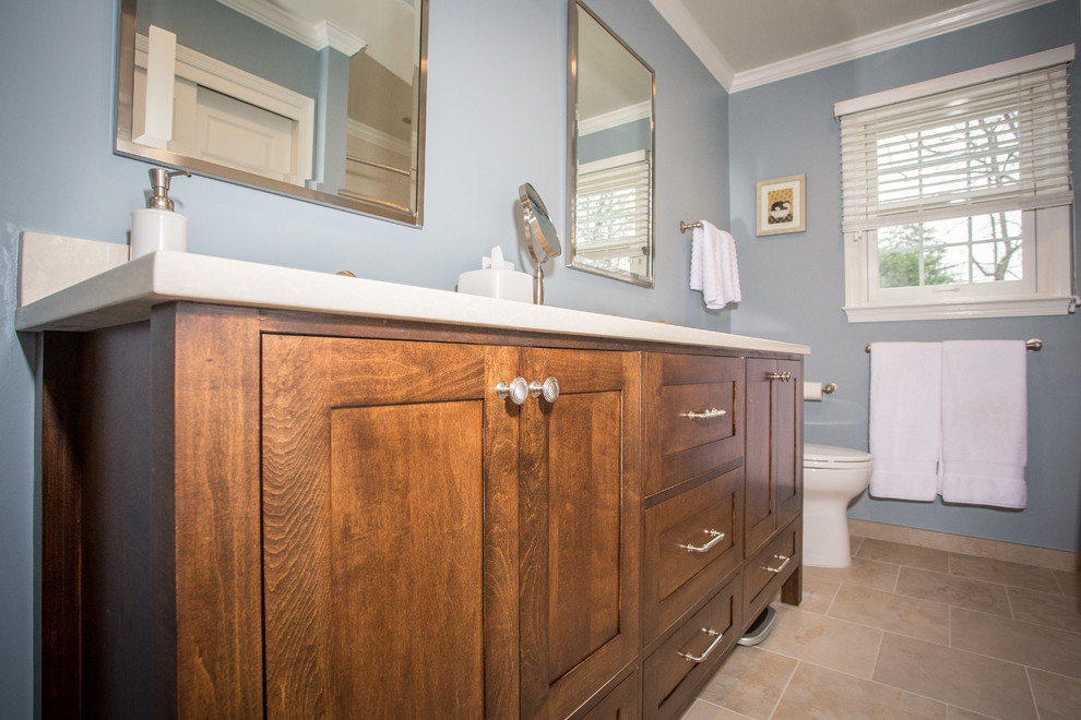 Bathroom - mid-sized transitional beige tile and porcelain tile porcelain tile bathroom idea in DC Metro with an undermount sink, flat-panel cabinets, dark wood cabinets, quartz countertops, a two-piece toilet and blue walls