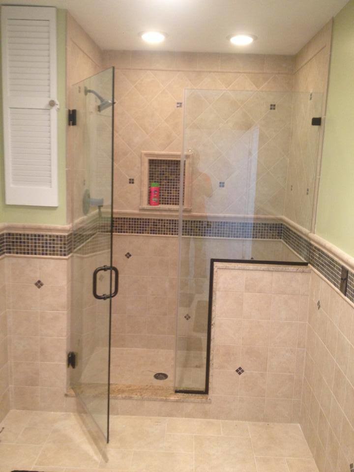 Alcove shower - mid-sized mediterranean beige tile, brown tile, multicolored tile and mosaic tile alcove shower idea in New York with green walls