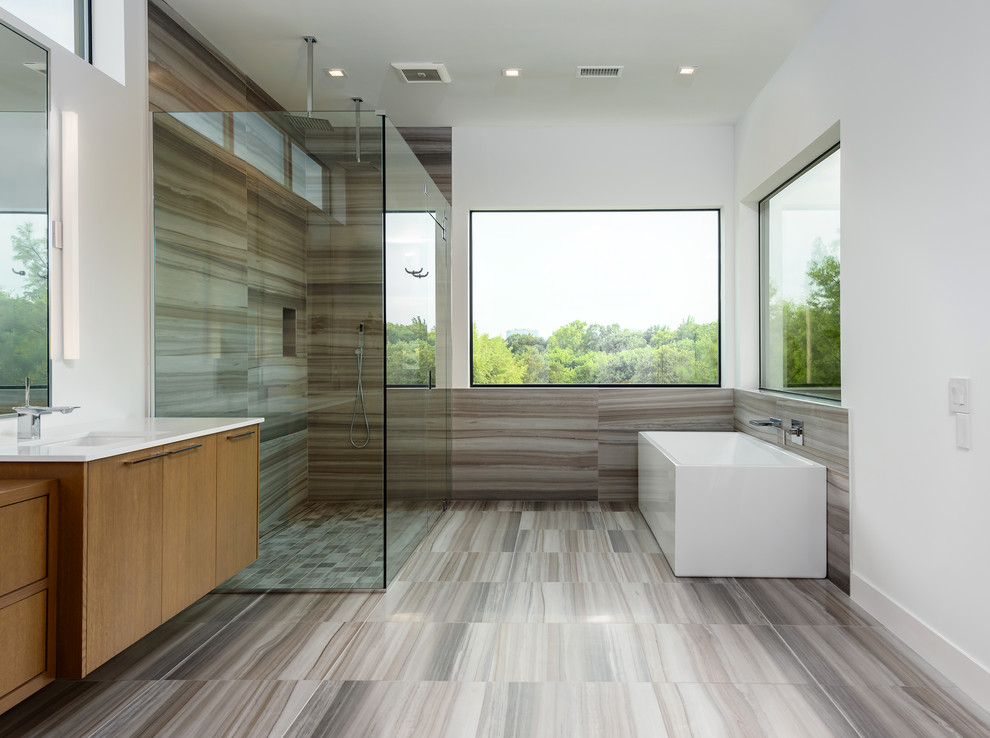 Medium sized contemporary ensuite bathroom in Dallas with flat-panel cabinets, medium wood cabinets, a freestanding bath, a corner shower, brown tiles, porcelain tiles, white walls, porcelain flooring, a vessel sink, wooden worktops, brown floors, a hinged door and brown worktops.