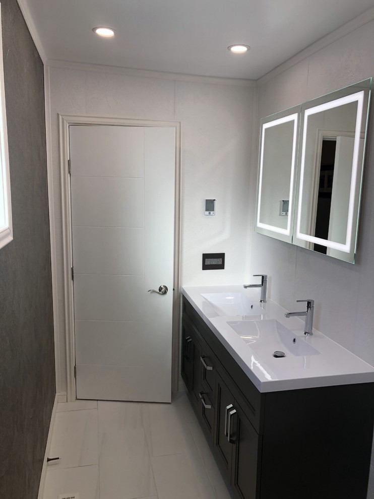 Photo of a medium sized modern ensuite bathroom in Other with freestanding cabinets, brown cabinets, a double shower, a two-piece toilet, white tiles, white walls, ceramic flooring, an integrated sink, soapstone worktops, white floors, a sliding door and white worktops.