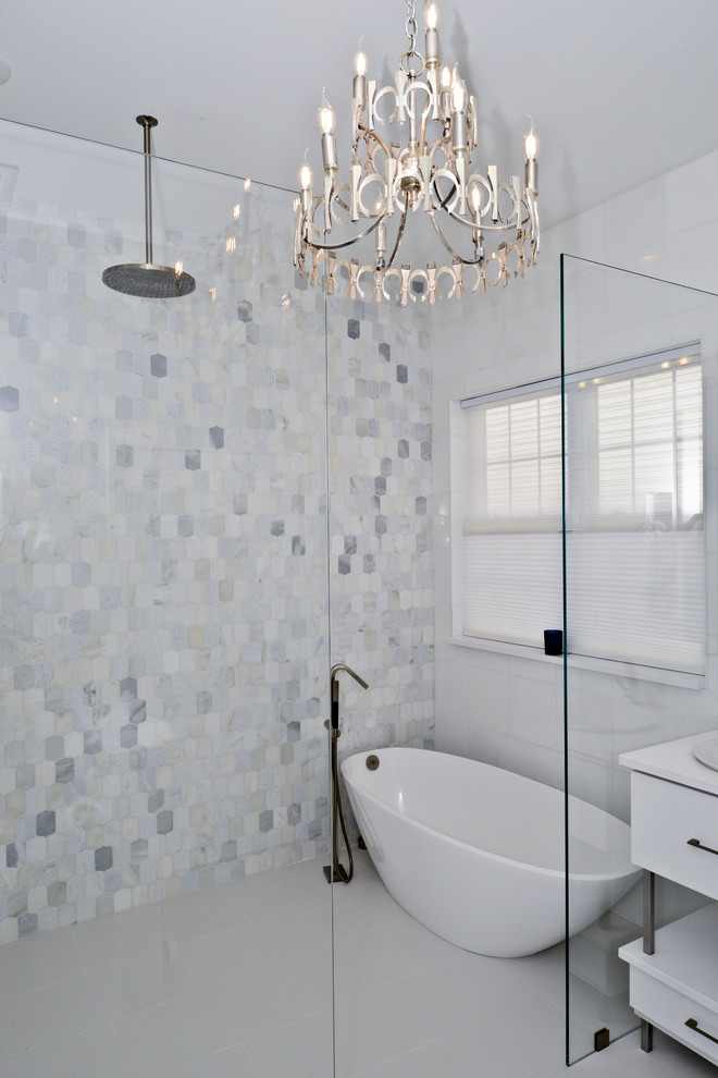 This is an example of a medium sized modern ensuite wet room bathroom in DC Metro with flat-panel cabinets, white cabinets, a freestanding bath, black and white tiles, beige walls, an integrated sink, white floors, an open shower and white worktops.