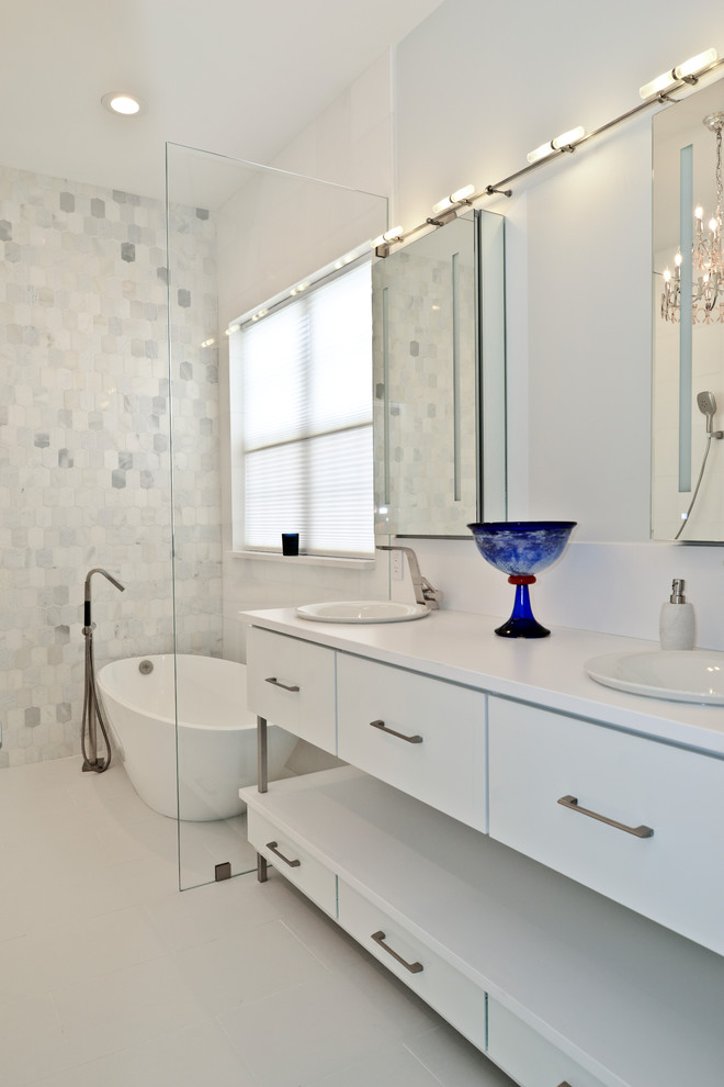 Photo of a medium sized modern ensuite wet room bathroom in DC Metro with flat-panel cabinets, white cabinets, a freestanding bath, black and white tiles, beige walls, an integrated sink, engineered stone worktops, white floors, an open shower and white worktops.