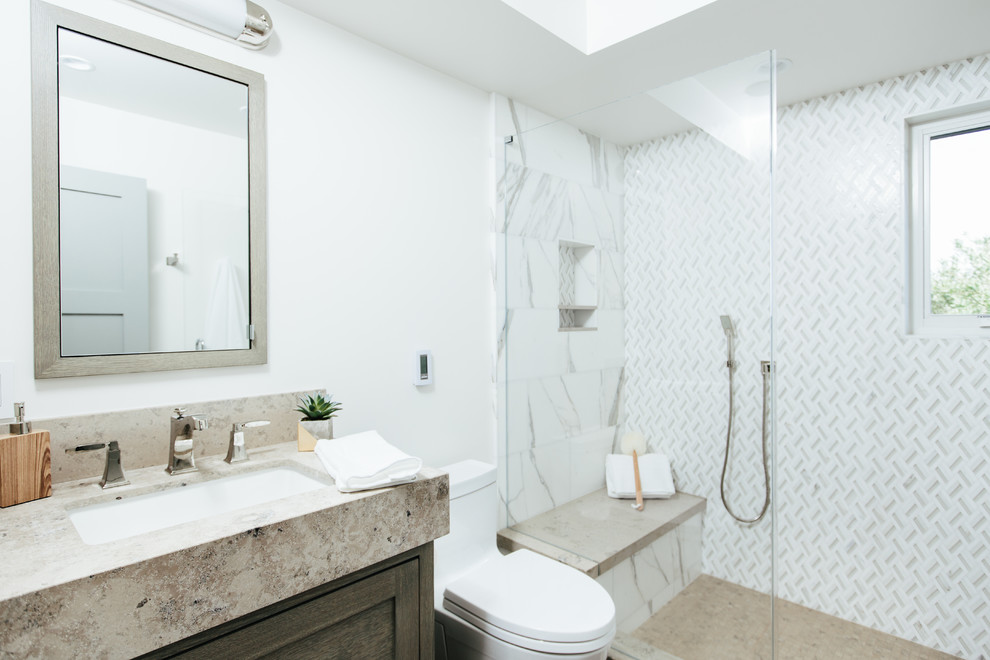 Bathroom - mid-sized contemporary 3/4 white tile and mosaic tile ceramic tile and beige floor bathroom idea in Orange County with shaker cabinets, dark wood cabinets, a one-piece toilet, white walls, an undermount sink and soapstone countertops