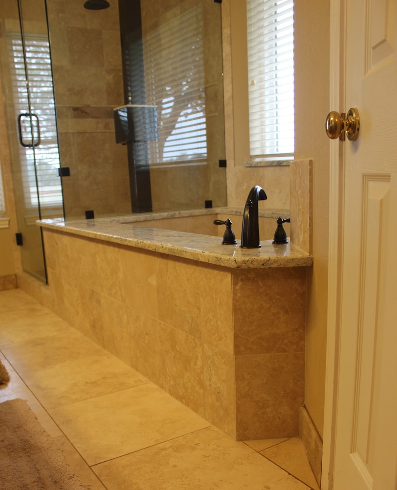 Mid-sized transitional master beige tile and stone tile travertine floor corner shower photo in Austin with an undermount sink, granite countertops, an undermount tub, a two-piece toilet and beige walls