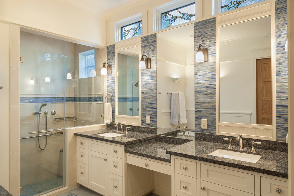 Inspiration for a medium sized classic ensuite bathroom in Houston with shaker cabinets, white cabinets, a walk-in shower, blue tiles, glass tiles, white walls, porcelain flooring, a submerged sink, granite worktops and grey floors.