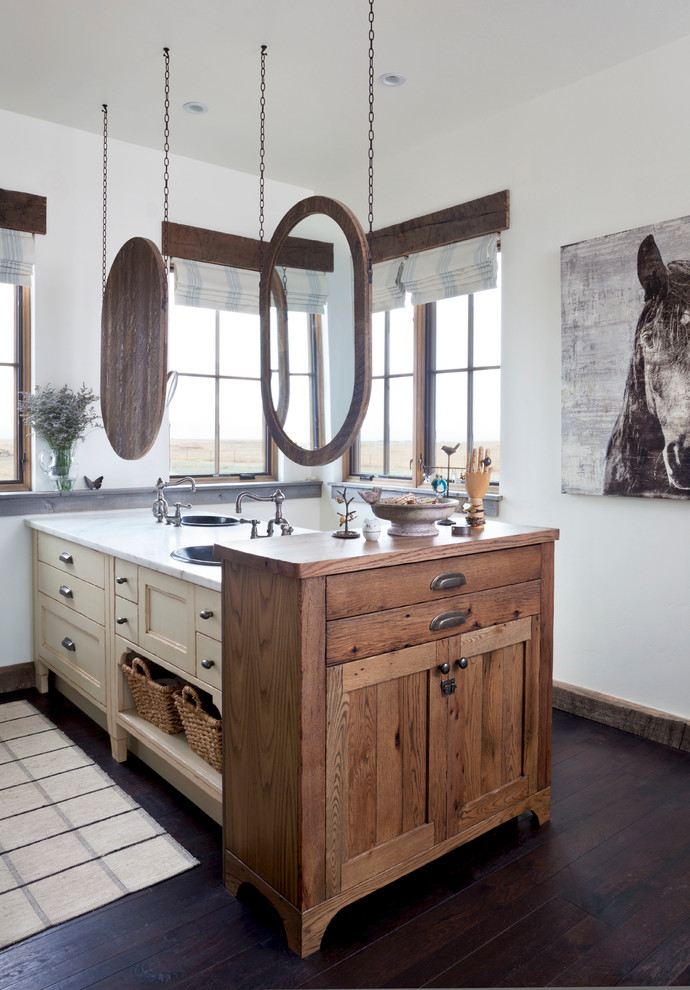 Farmhouse bathroom in Denver with a built-in sink, white walls, dark hardwood flooring and recessed-panel cabinets.