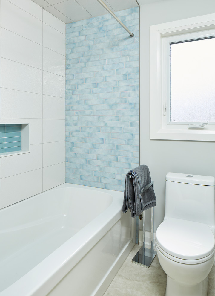 Inspiration for a mid-sized coastal blue tile, white tile and porcelain tile porcelain tile and beige floor bathroom remodel in Toronto with flat-panel cabinets, dark wood cabinets, blue walls, an undermount sink and marble countertops