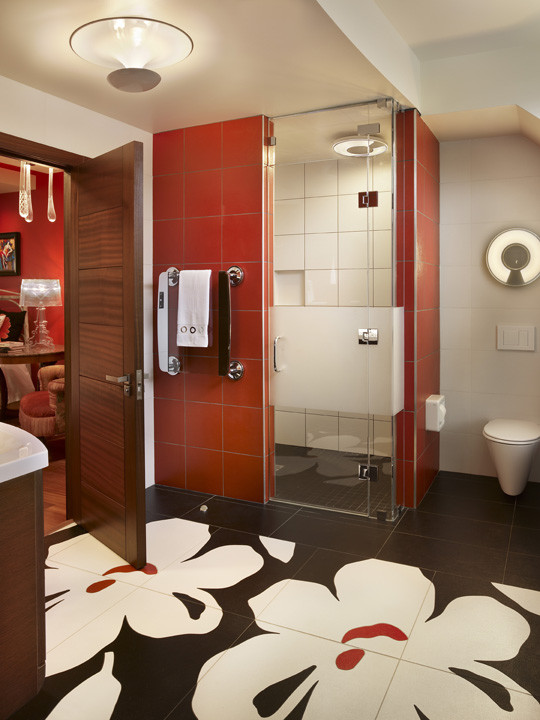 Example of a mid-sized trendy master black tile and porcelain tile porcelain tile walk-in shower design in Philadelphia with a console sink, flat-panel cabinets, red cabinets, granite countertops, a wall-mount toilet and white walls