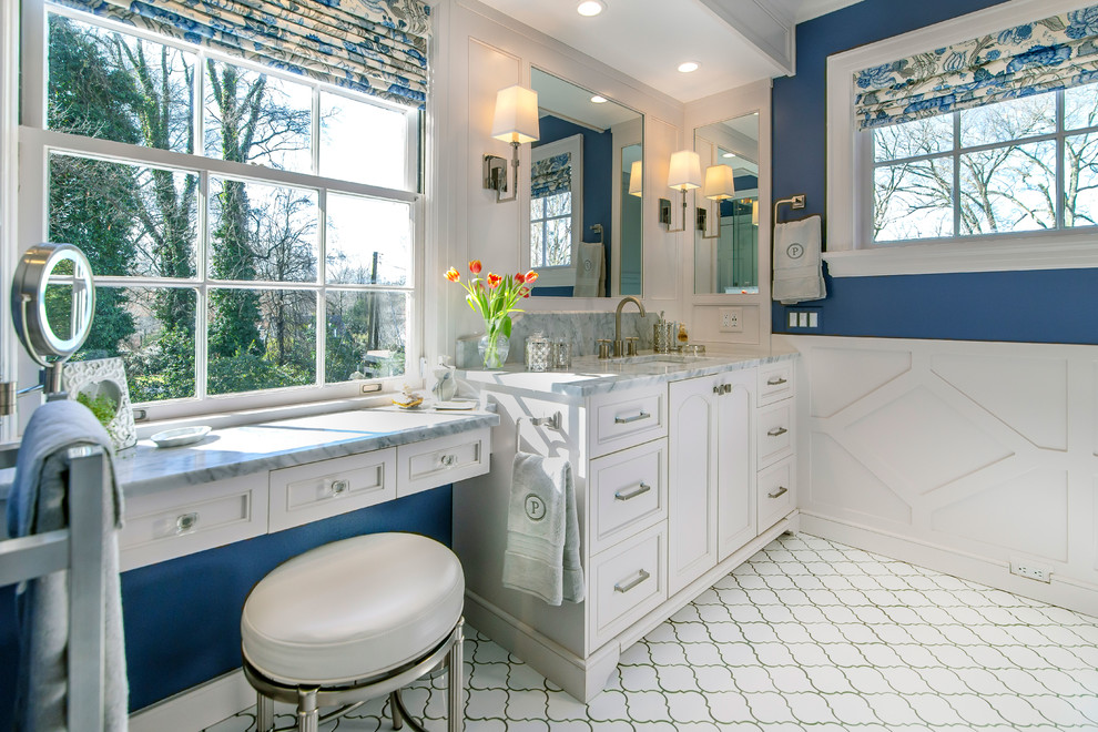 Example of a classic master ceramic tile and white floor double shower design in Charlotte with beaded inset cabinets, white cabinets, blue walls, marble countertops, a hinged shower door and gray countertops