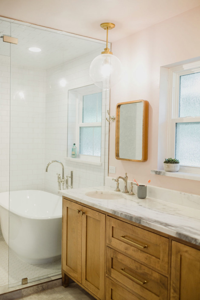 Medium sized modern ensuite wet room bathroom in Dallas with freestanding cabinets, white cabinets, a one-piece toilet, white tiles, ceramic tiles, orange walls, ceramic flooring, black floors, an open shower and white worktops.
