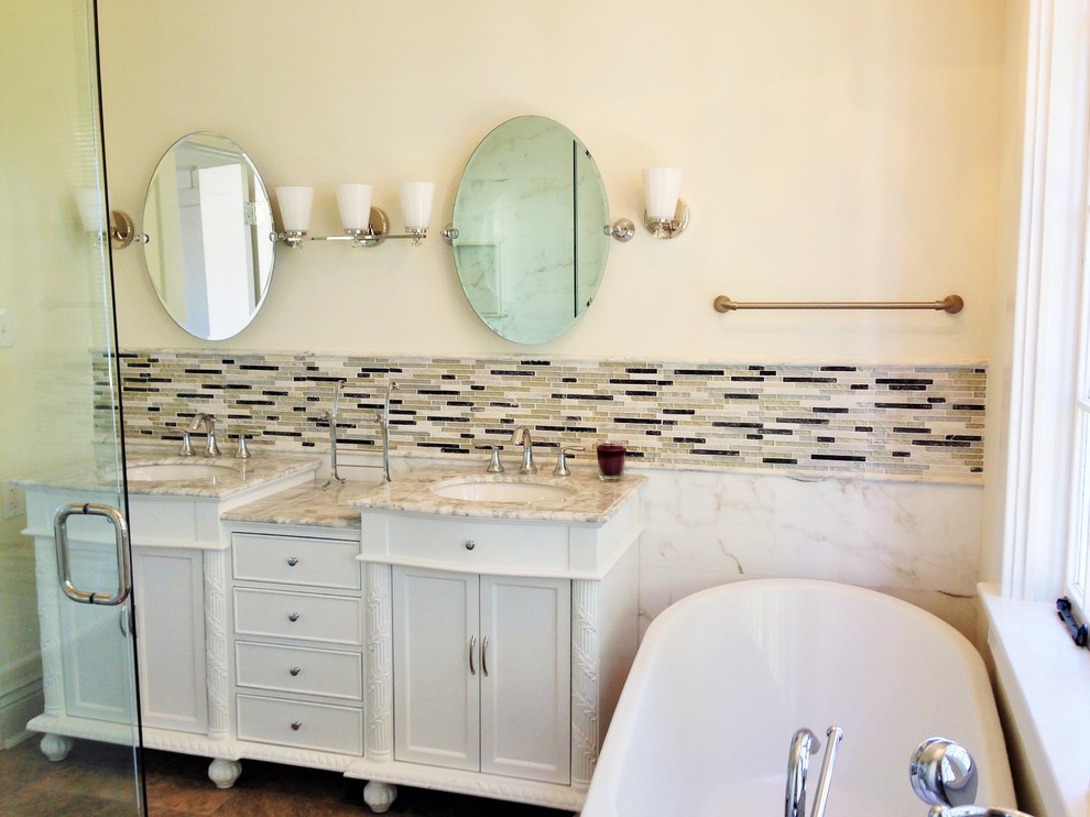 Transitional gray tile bathroom photo in New Orleans with an undermount sink, furniture-like cabinets, white cabinets, marble countertops and a one-piece toilet