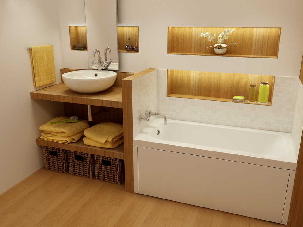 Example of a mid-sized trendy 3/4 white tile and mosaic tile medium tone wood floor and brown floor bathroom design in Montreal with open cabinets, an undermount tub, beige walls, a vessel sink and wood countertops