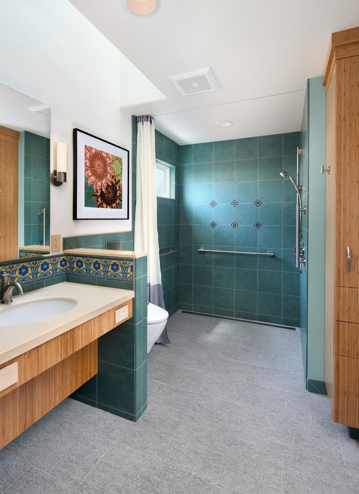 Large mediterranean ensuite bathroom in San Francisco with a walk-in shower, a wall mounted toilet, multi-coloured tiles, porcelain tiles, multi-coloured walls, porcelain flooring, a submerged sink, grey floors and an open shower.