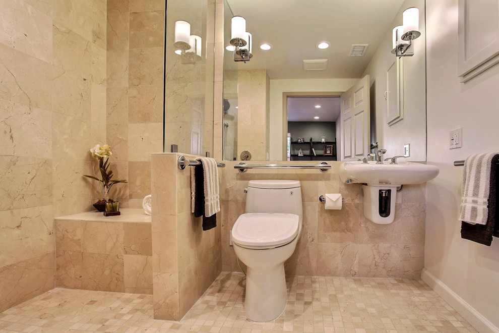 Idéer för att renovera ett mellanstort funkis en-suite badrum, med ett väggmonterat handfat, en kantlös dusch, en bidé, beige kakel, beige väggar och marmorgolv
