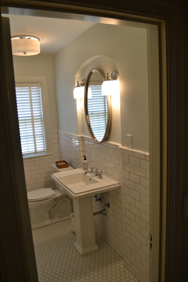 Example of a classic white tile and porcelain tile porcelain tile tub/shower combo design in Louisville with a pedestal sink and green walls