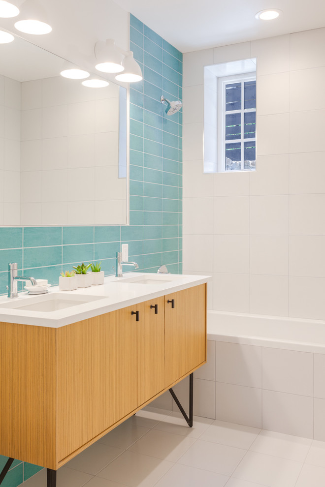 Inspiration for a small contemporary kids' blue tile and ceramic tile ceramic tile and white floor bathroom remodel in Denver with flat-panel cabinets, light wood cabinets, a one-piece toilet, white walls, an undermount sink and quartz countertops