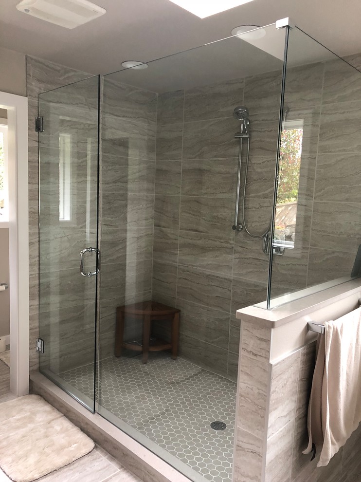 Large transitional master gray tile and porcelain tile porcelain tile and gray floor bathroom photo in Seattle with shaker cabinets, medium tone wood cabinets, a two-piece toilet, beige walls, a vessel sink, quartzite countertops, a hinged shower door and gray countertops