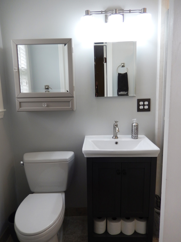 Example of a small transitional bathroom design in Other with a two-piece toilet, white walls and an integrated sink