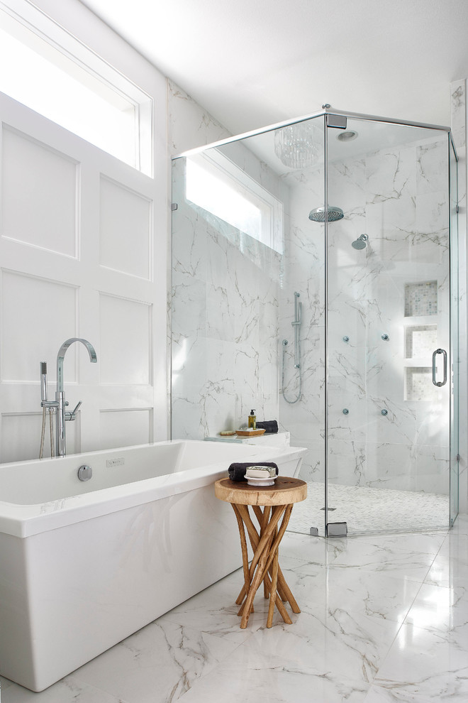 Inspiration for a mid-sized transitional master white tile and porcelain tile porcelain tile bathroom remodel in Orlando with an undermount sink, shaker cabinets, white cabinets, marble countertops, a one-piece toilet and white walls