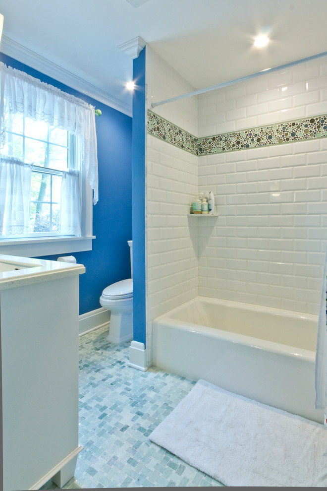 Contemporary bathroom in Newark with an alcove bath, a shower/bath combination and blue walls.