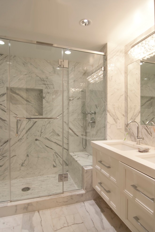 Design ideas for a large classic ensuite bathroom in New York with raised-panel cabinets, white cabinets, an alcove shower, a wall mounted toilet, white tiles, marble tiles, multi-coloured walls, marble flooring, a submerged sink, engineered stone worktops, multi-coloured floors, a sliding door and white worktops.