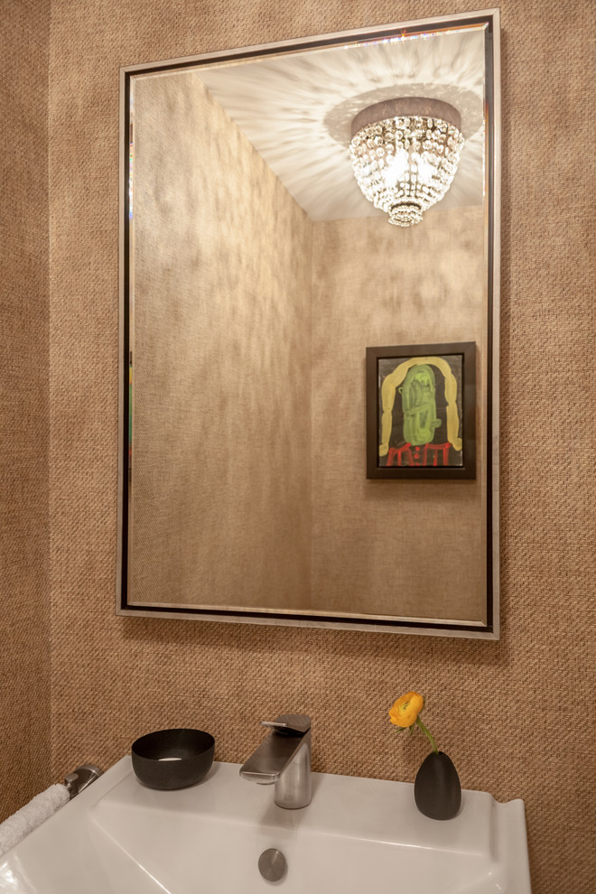 This is an example of a small contemporary cloakroom in New York with a one-piece toilet and a pedestal sink.