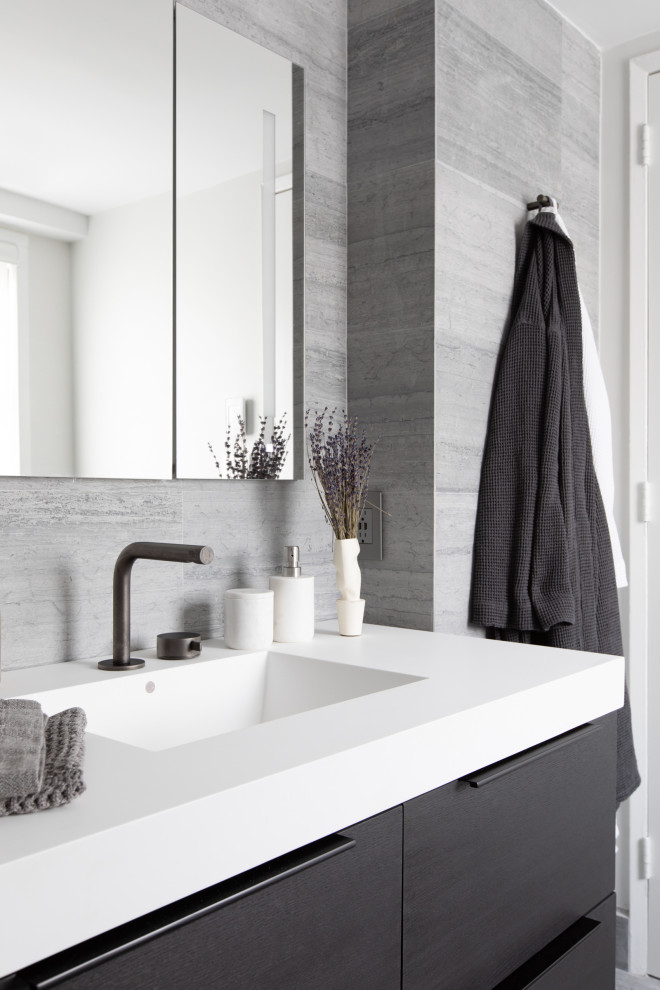 Example of a mid-sized trendy master single-sink bathroom design in New York with furniture-like cabinets, dark wood cabinets, white countertops and a floating vanity