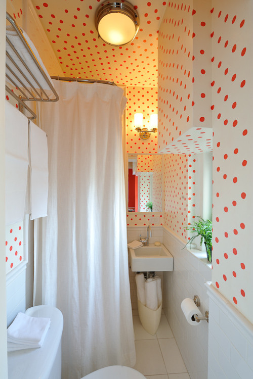 Small romantic shower room bathroom in New York with a corner shower, a two-piece toilet, white tiles, metro tiles, multi-coloured walls, ceramic flooring and a wall-mounted sink.