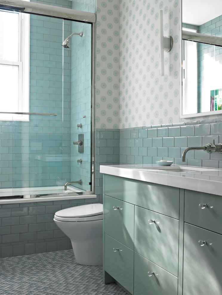 Example of a trendy blue tile bathroom design in New York with flat-panel cabinets, blue cabinets and white countertops