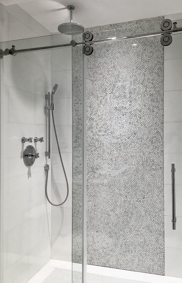 Photo of a medium sized traditional ensuite bathroom in New York with grey tiles and a shower/bath combination.