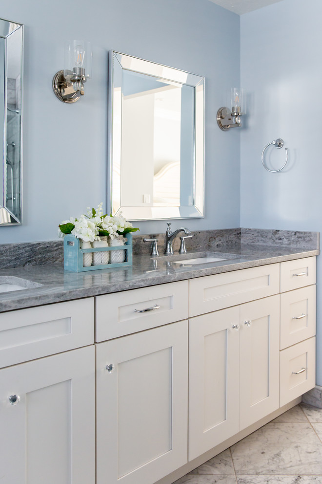 Inspiration for a huge coastal master marble floor and gray floor freestanding bathtub remodel in Other with shaker cabinets, white cabinets, blue walls, an undermount sink, quartz countertops and gray countertops