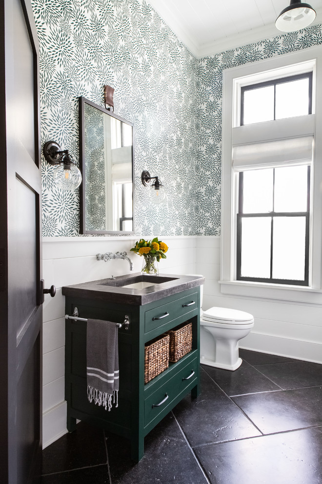 Inspiration for a large cottage 3/4 limestone floor and black floor bathroom remodel in New York with recessed-panel cabinets, green cabinets, a two-piece toilet, green walls, an undermount sink, concrete countertops and gray countertops