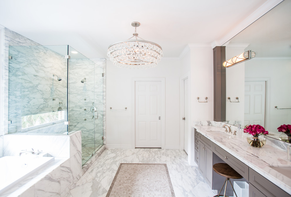 Design ideas for a classic ensuite bathroom in Houston with grey cabinets, white walls, marble flooring, a submerged sink, recessed-panel cabinets, a built-in bath, marble worktops and white tiles.