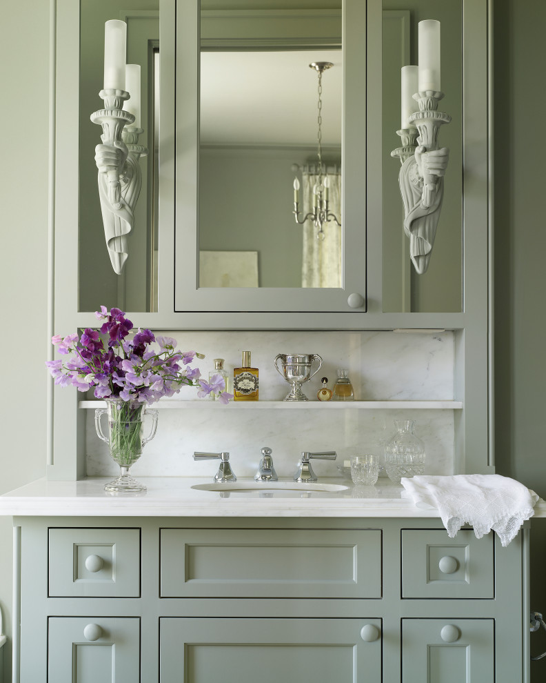 Elegant single-sink bathroom photo in Austin with beaded inset cabinets, green cabinets, white countertops and a built-in vanity