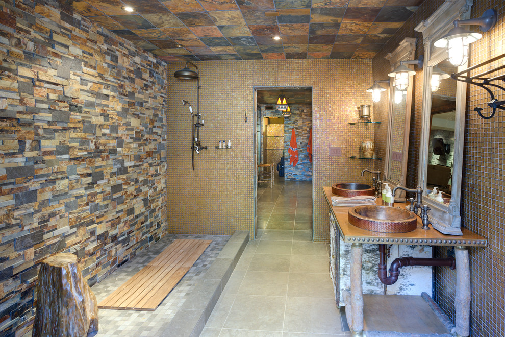 Ejemplo de cuarto de baño mediterráneo con lavabo sobreencimera, ducha abierta, baldosas y/o azulejos multicolor, paredes marrones y suelo de baldosas de cerámica