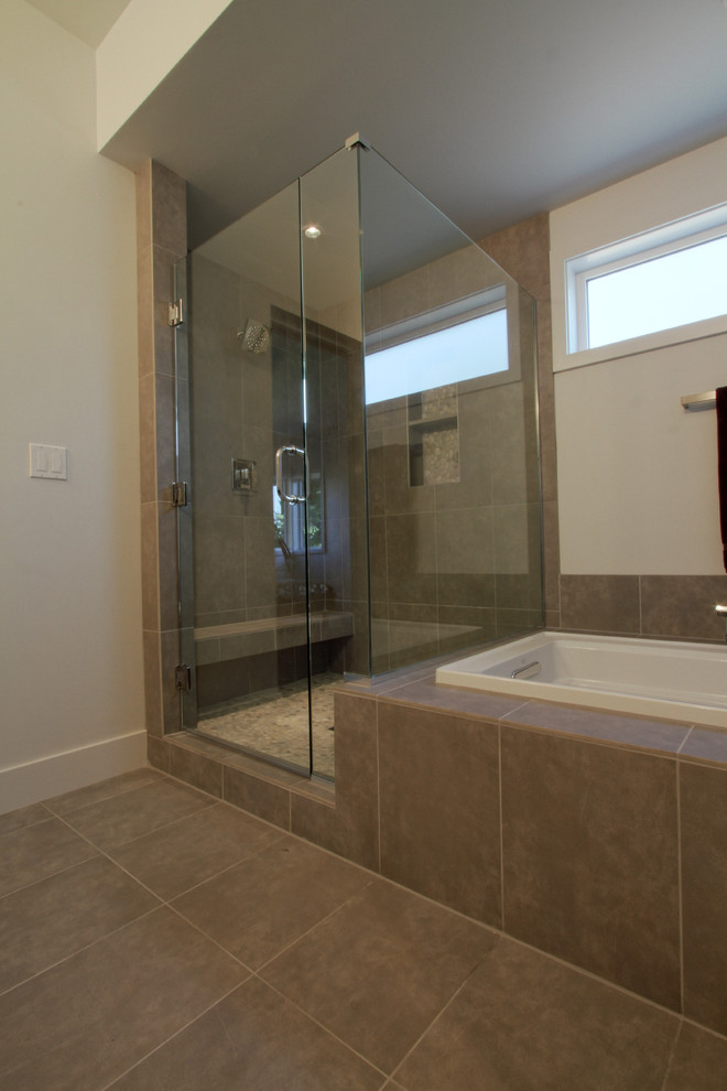 Large minimalist master beige tile and porcelain tile porcelain tile bathroom photo in Portland with a vessel sink, flat-panel cabinets, dark wood cabinets, quartz countertops, a two-piece toilet and beige walls