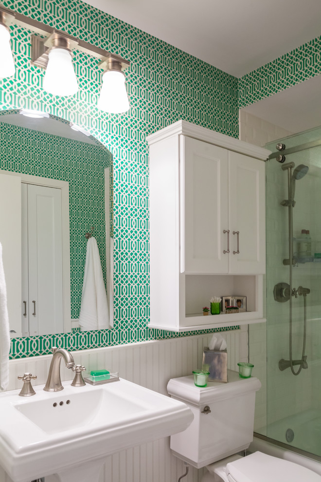 Example of a mid-sized transitional 3/4 white tile and subway tile bathroom design in Chicago with recessed-panel cabinets, white cabinets, a two-piece toilet, green walls and a pedestal sink