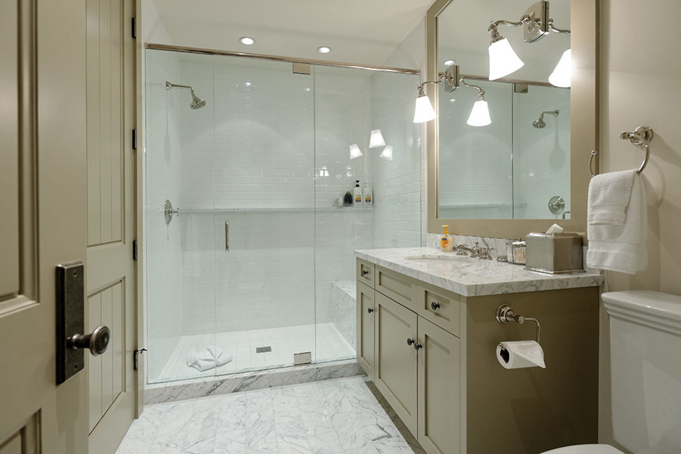 Inspiration for a large modern ensuite bathroom in Denver with louvered cabinets, beige cabinets, a built-in bath, a walk-in shower, a one-piece toilet, black and white tiles, ceramic tiles, beige walls, ceramic flooring, a built-in sink and marble worktops.