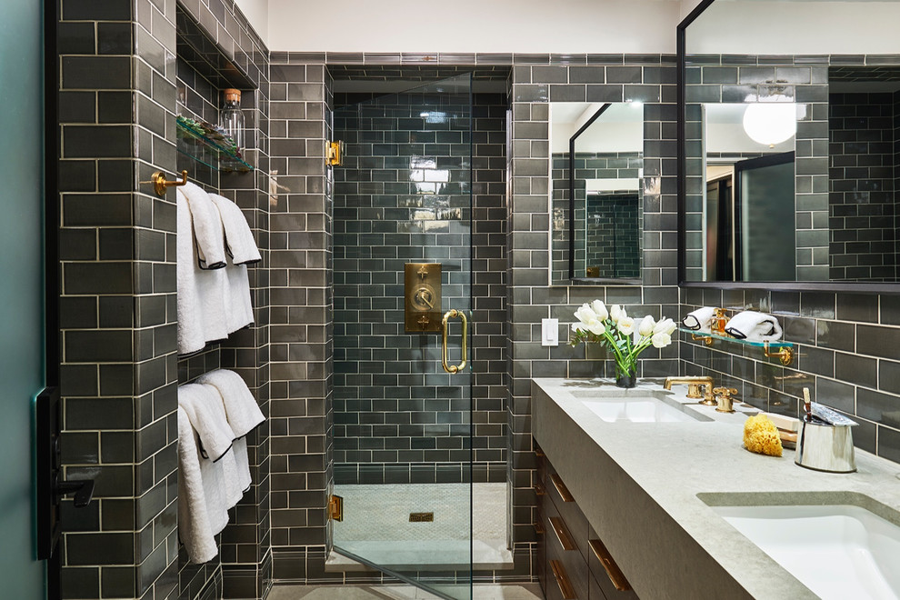 Inspiration for a large classic ensuite bathroom in New York with flat-panel cabinets, dark wood cabinets, an alcove shower, a one-piece toilet, grey tiles, metro tiles, grey walls, ceramic flooring, a submerged sink, marble worktops, beige floors and a hinged door.