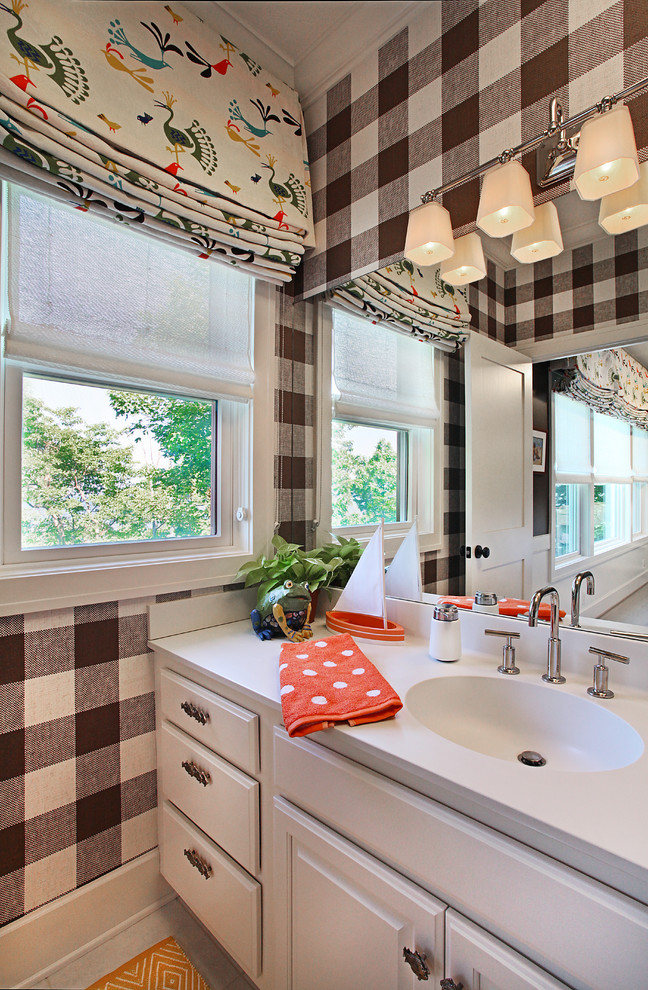 Bathroom - traditional kids' bathroom idea in Grand Rapids with an integrated sink, raised-panel cabinets and white cabinets