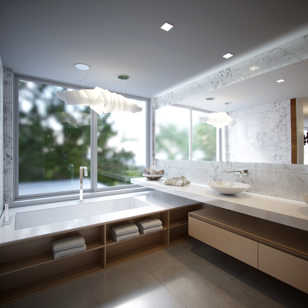This is an example of a contemporary ensuite bathroom in Miami with flat-panel cabinets, light wood cabinets, concrete flooring and a vessel sink.